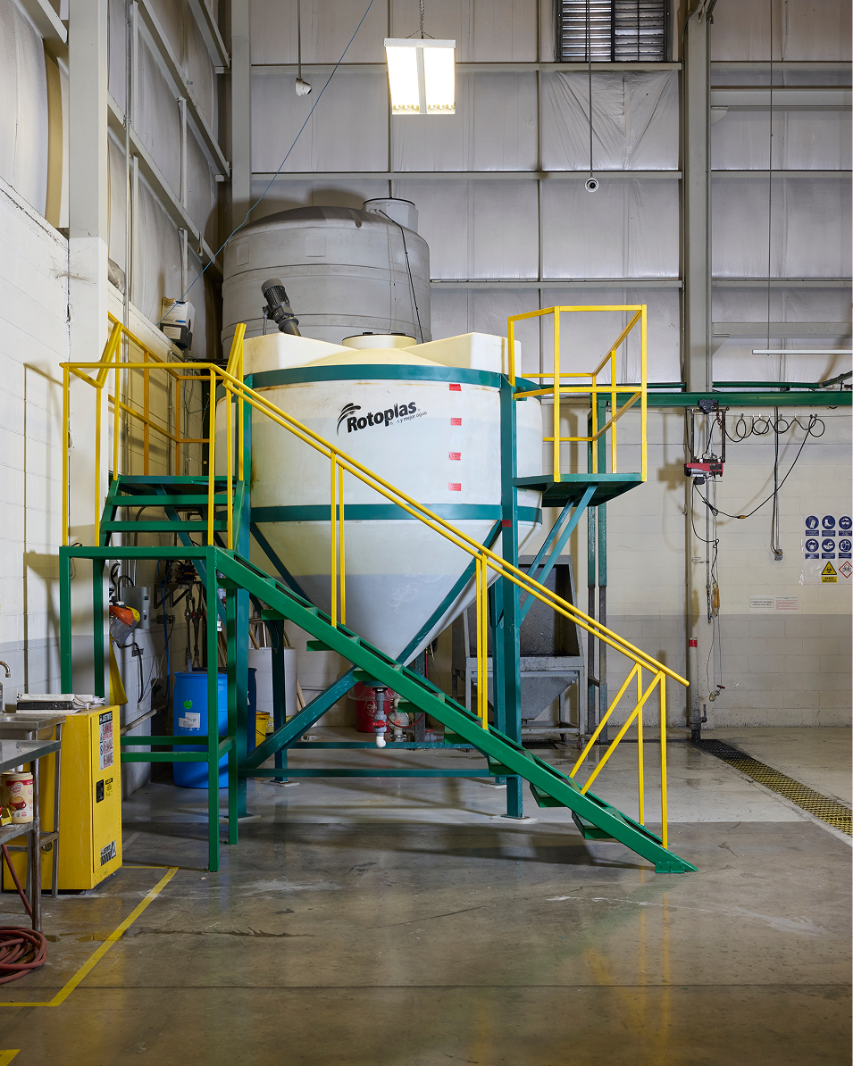 Large industrial mixer with 'Rotoplas' branding in a factory setting