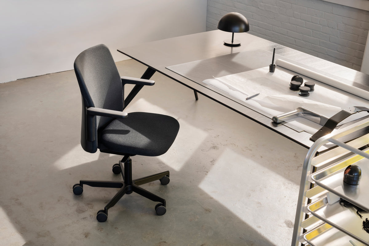 Modern office desk with a chair in a minimalistic office setting